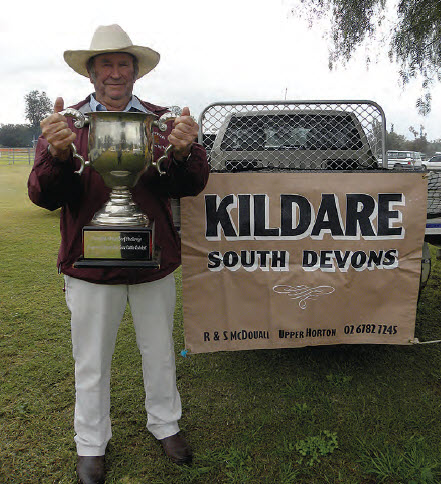 Rick McDouall proudly displays the Cattlemans Cup, won by his two-year-old heifer, Kildare Sassy.