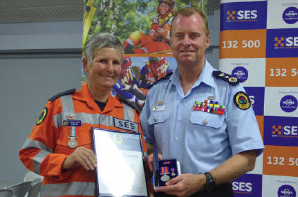 Rhonda King of Bingara being presented with a Long Service Award recently by NSW SES Commissioner Mark Smethurst.
