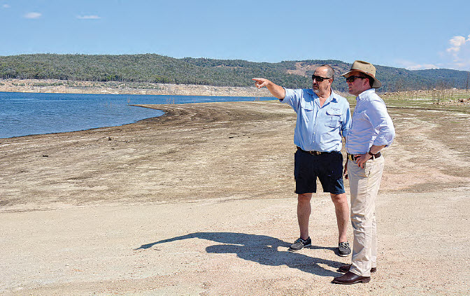 Northern Tablelands MP Adam Marshall, left, and Copeton Waters Holiday Park Manager Dave Allen at the 30 per cent mark on Sepoy Knob boat ramp.