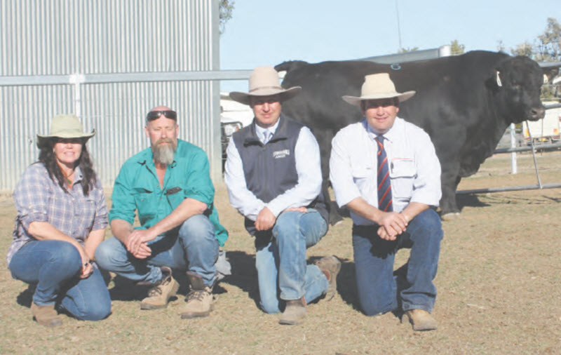 Kevin and Tracy Owen were very happy with their purchase of Lot 6, the second top price achieved at the Booroomooka sale. They are pictured with stud principal, Sinclair Munro and auctioneer, Luke Scicluna.